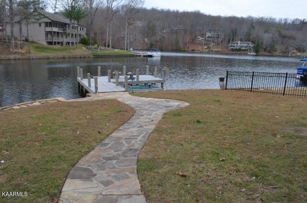 13 Hampton Point Crossville, TN 38558 - Photo 4 of 45 a view of a lake with a yard and large trees