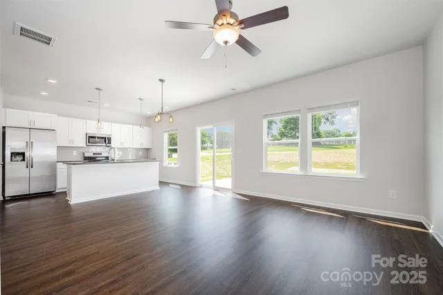 a view of kitchen with window and wooden floor