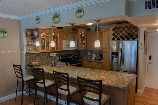 a kitchen with a table and chairs in it