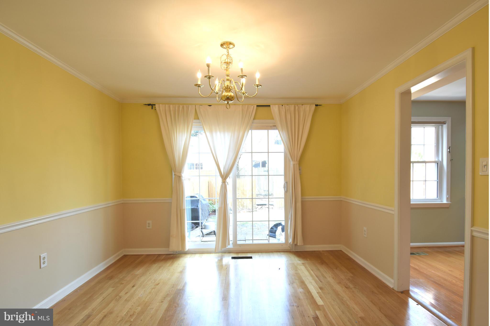 7033 Leestone Street Springfield, VA 22151 - Photo 8 of 25 WALKOUT DINING ROOM WITH HARDWOOD FLOOR