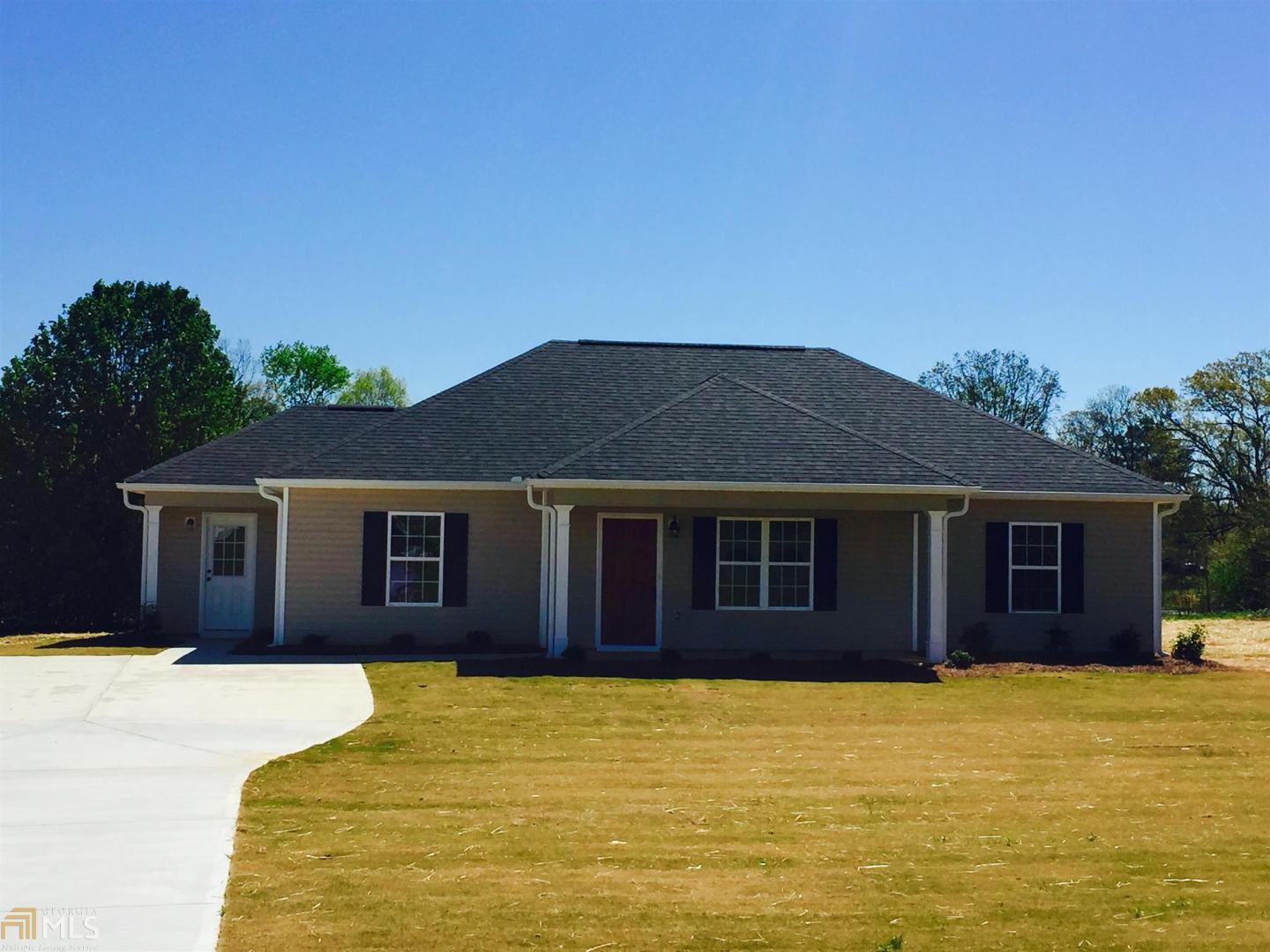 317 Bell Road Milner, GA 30257 - Photo 1 of 1 a front view of a house with a yard