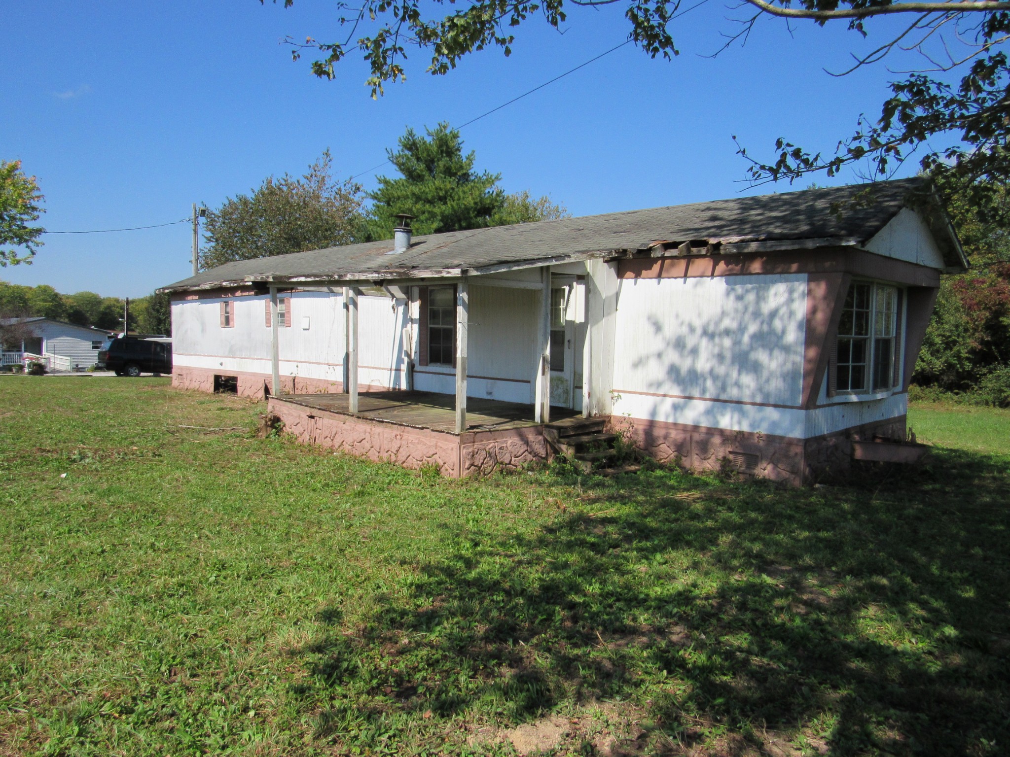 4438 Gnat Hill Road Manchester, TN 37355 - Photo 1 of 9 a backyard of a house with table and chairs