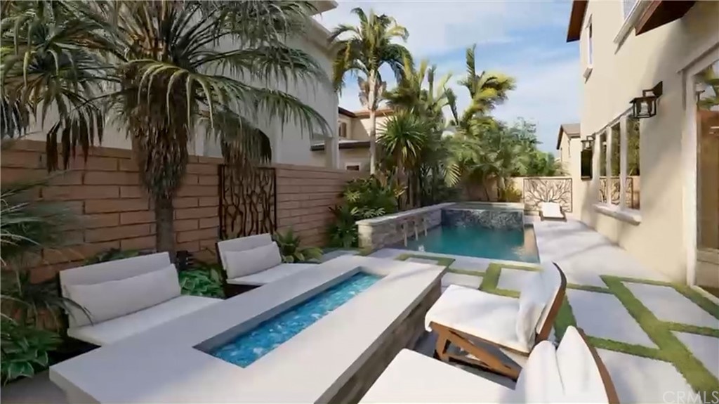 a view of a patio with couches table and chairs with potted plants and palm trees