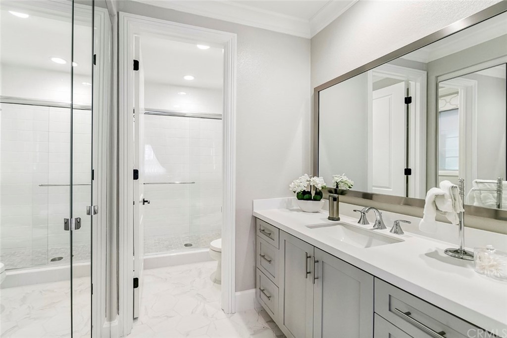 65 Rockinghorse Irvine, CA 92602 - Photo 15 of 43 a bathroom with a double vanity sink mirror double and shower