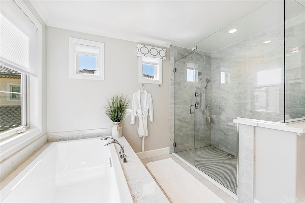 65 Rockinghorse Irvine, CA 92602 - Photo 25 of 43 a bathroom with a tub shower and sink
