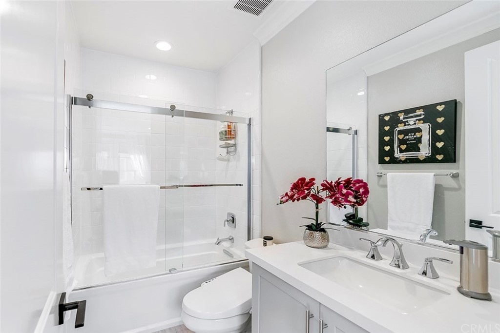 65 Rockinghorse Irvine, CA 92602 - Photo 28 of 43 a bathroom with a sink vanity mirror bathtub and toilet