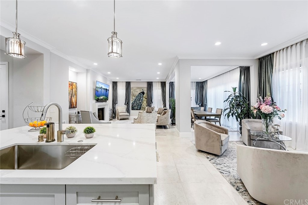 65 Rockinghorse Irvine, CA 92602 - Photo 9 of 43 a view of living room with kitchen island stainless steel appliances furniture a living room and living room view