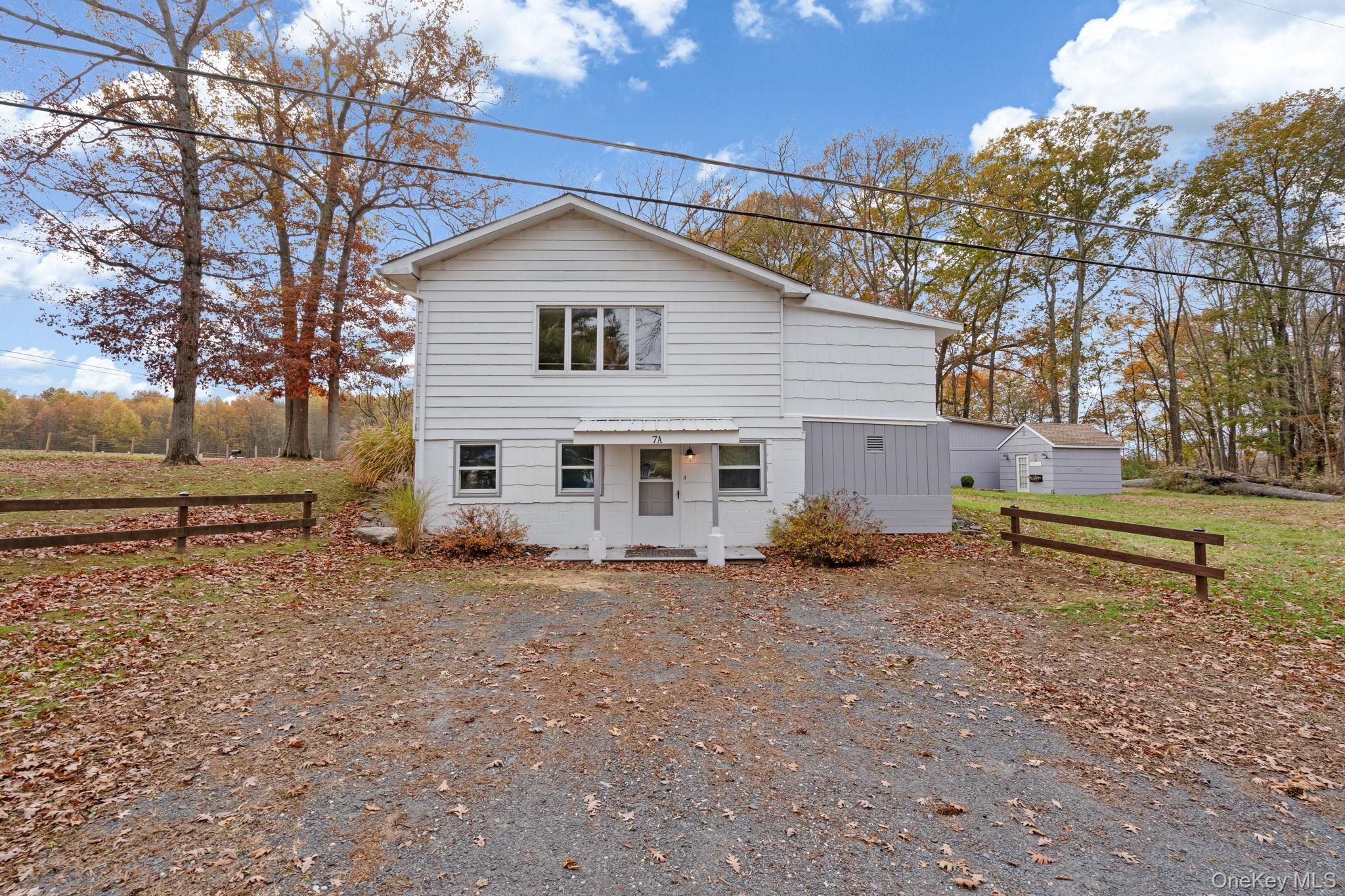 7 Red Top Road, Unit 2 Wallkill, NY 12589 - Photo 4 of 24 a view of a house with a yard and a tree