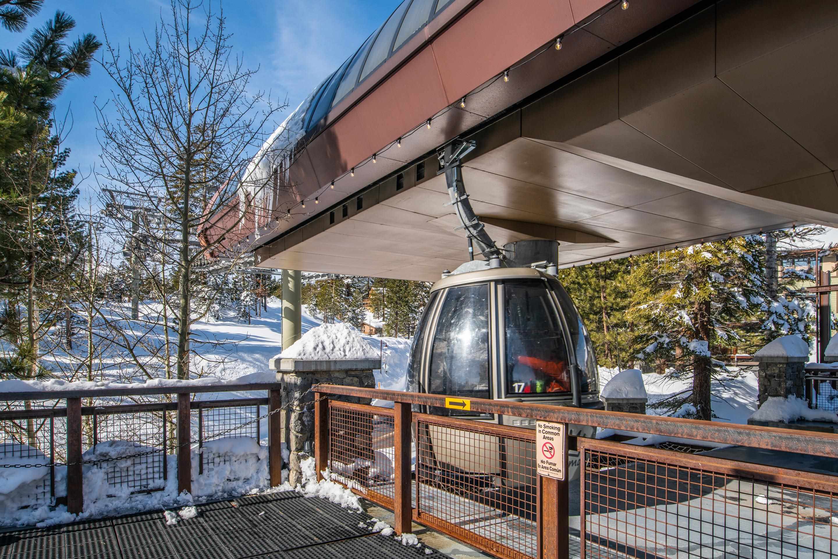 6201 Minaret Road, Unit 2221 Mammoth Lakes, CA 93546 - Photo 38 of 44 Gondola station with a clear gondola car arriving at the platform