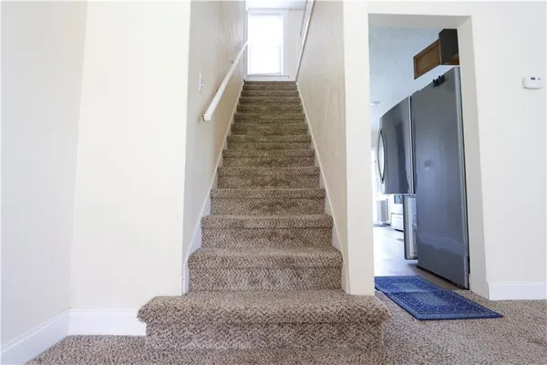 a view of entryway with wooden floor