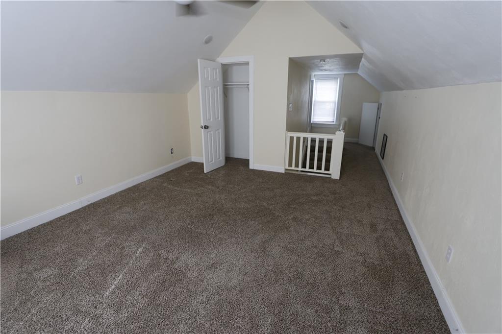 110 Blanche Road Fredericktown, PA 15333 - Photo 31 of 39 an empty room with windows and way to kitchen
