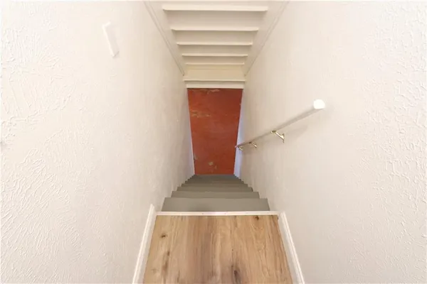 a view of a hallway with staircase