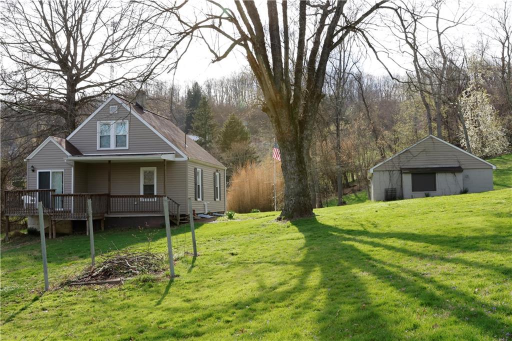110 Blanche Road Fredericktown, PA 15333 - Photo 5 of 39 a front view of a house with a garden