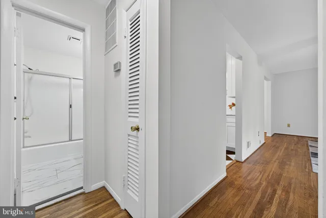 a bathroom with a shower a toilet and a sink