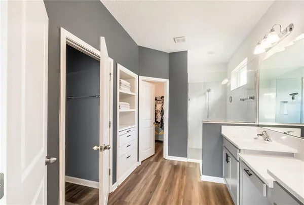 a view of a hallway with a washer and dryer