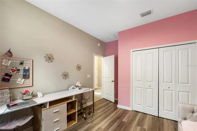 an aerial view of a house with a swimming pool