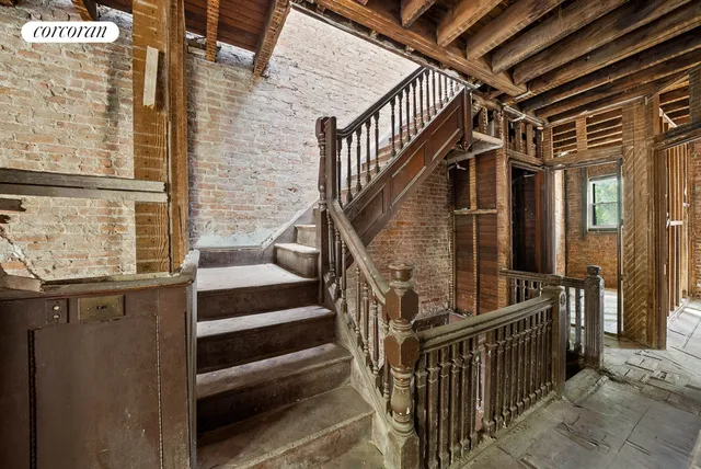 a view of a porch with a table and chairs