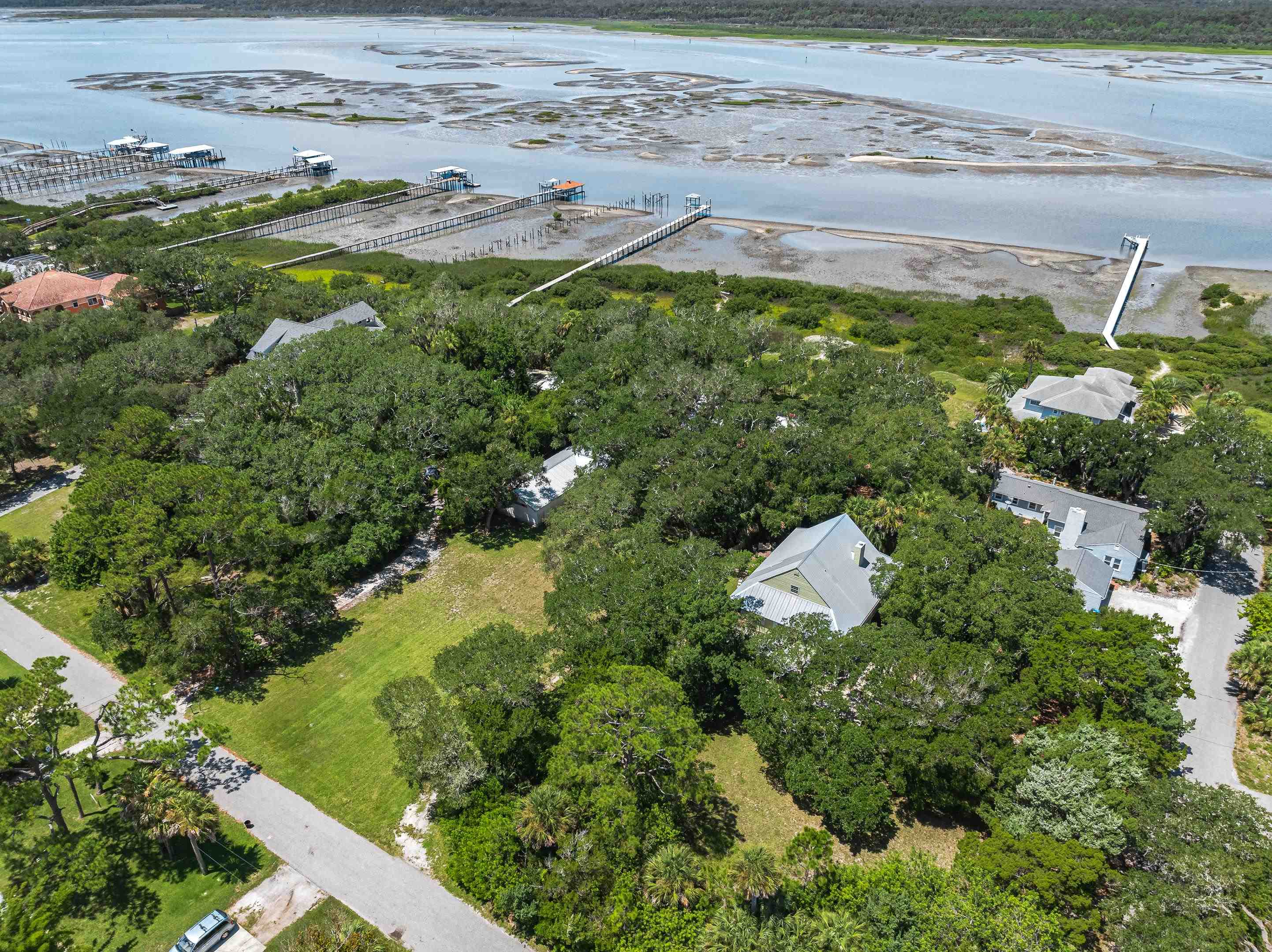 5425 A Windantide Road St. Augustine, FL 32080 - Photo 7 of 10 a view of a lake with a yard