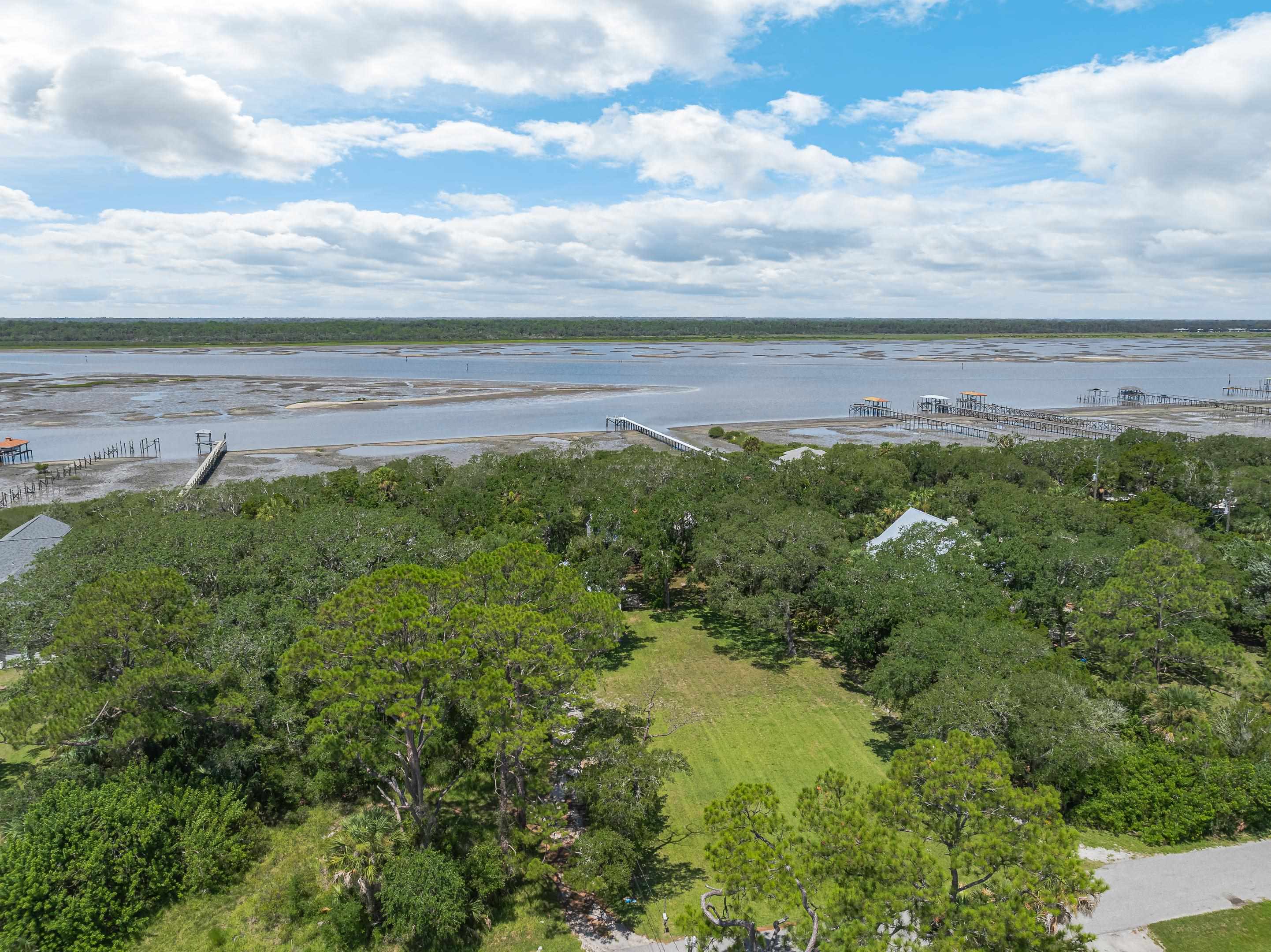 5425 A Windantide Road St. Augustine, FL 32080 - Photo 9 of 10 a view of a green field with lots of trees