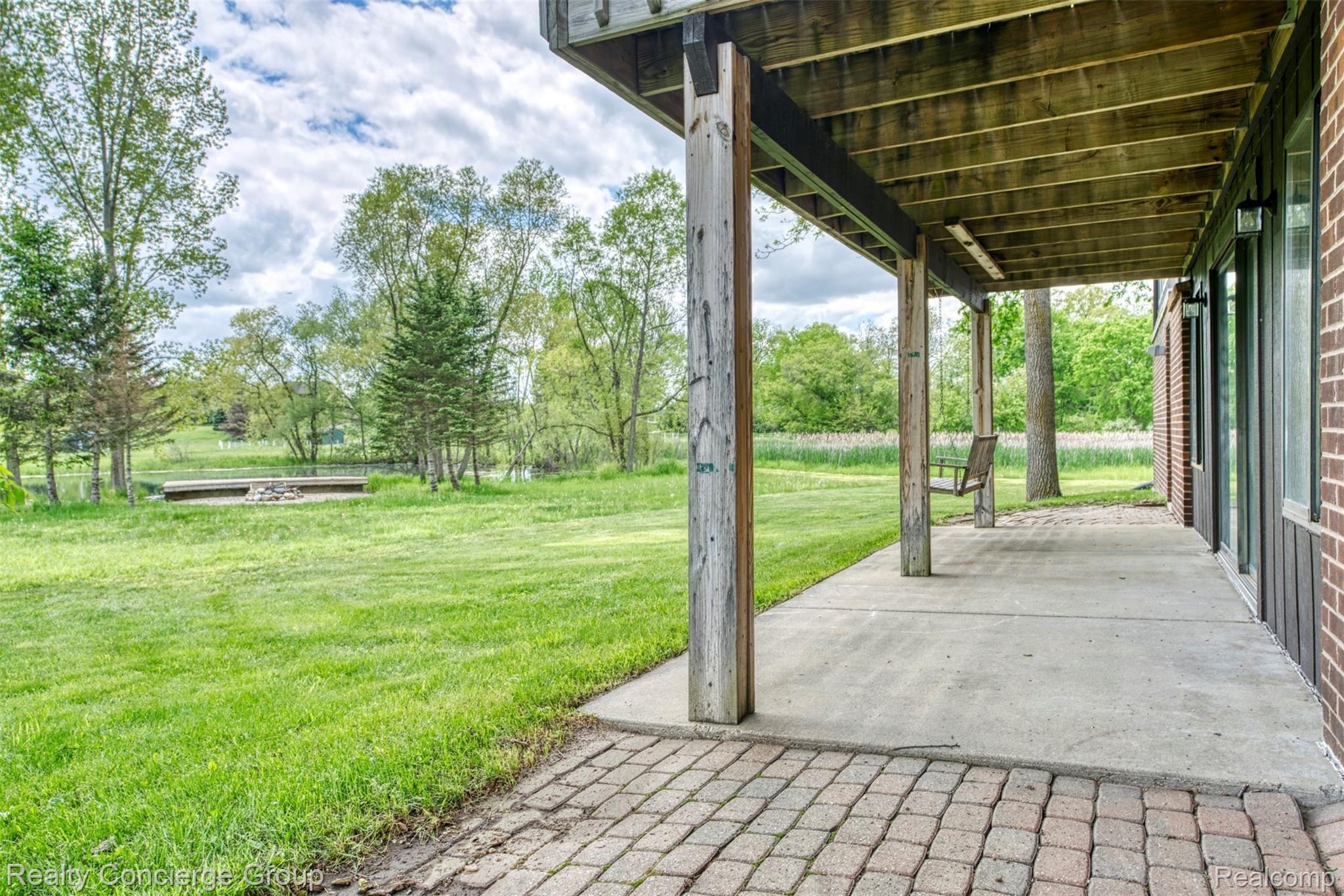 2110 East Clyde Road Howell, MI 48855 - Photo 25 of 44 This view is perfect for the fellow nature lover: mature trees, skyline and pond views