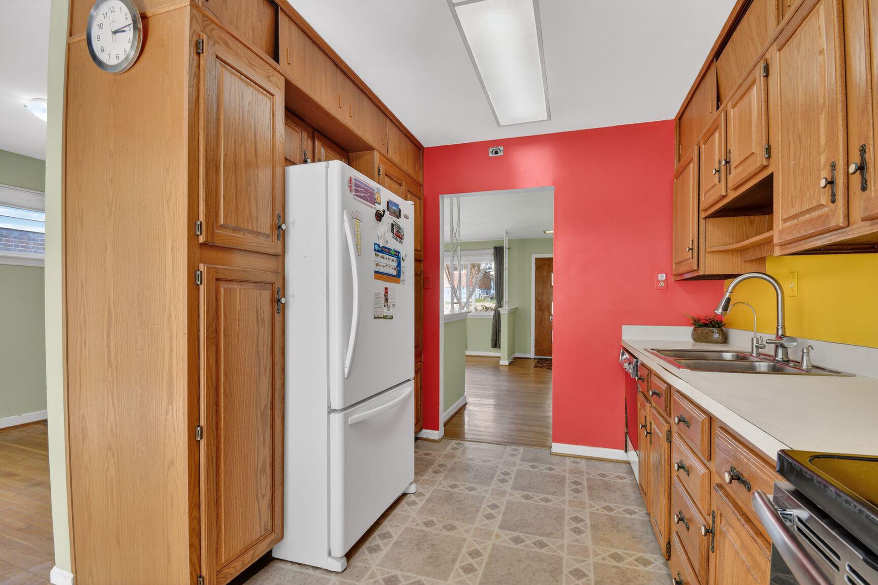 10226 Leslie Street Silver Spring, MD 20910 - Photo 11 of 32 a kitchen with stainless steel appliances granite countertop a refrigerator and a stove