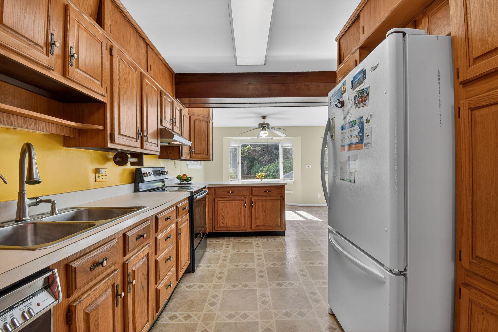 10226 Leslie Street Silver Spring, MD 20910 - Photo 12 of 32 a kitchen with stainless steel appliances granite countertop a refrigerator a sink and a stove