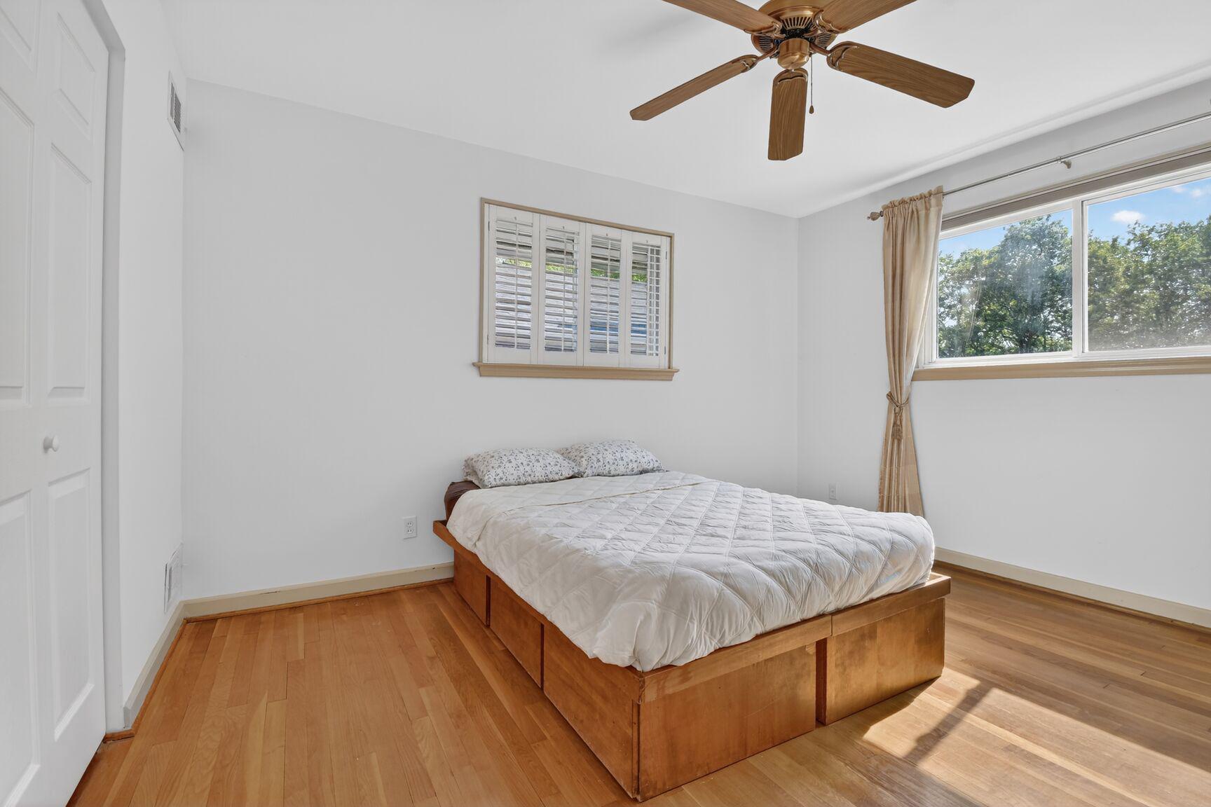 10226 Leslie Street Silver Spring, MD 20910 - Photo 13 of 32 a bedroom with a bed and window