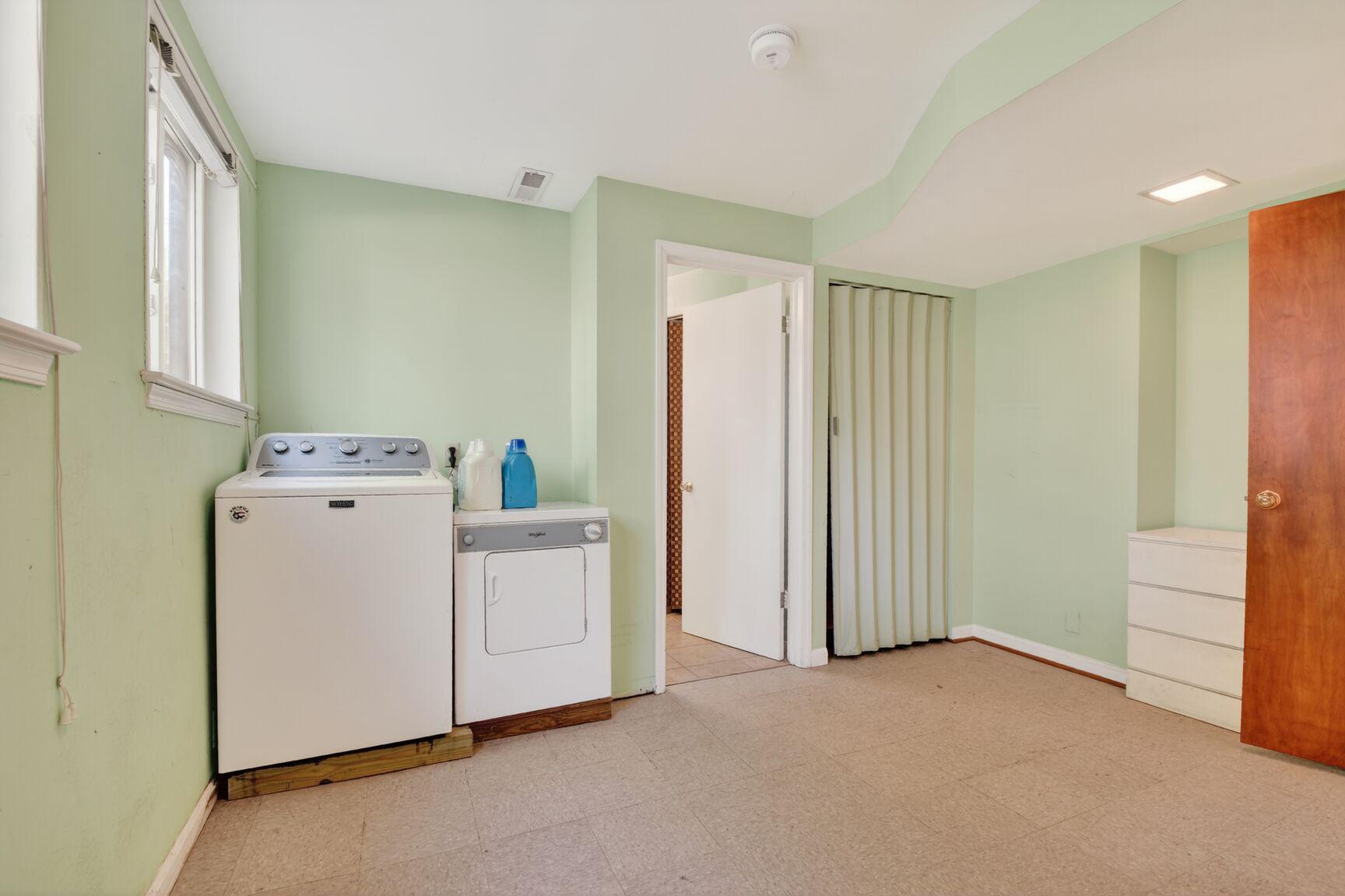 10226 Leslie Street Silver Spring, MD 20910 - Photo 21 of 32 a utility room with dryer and washer