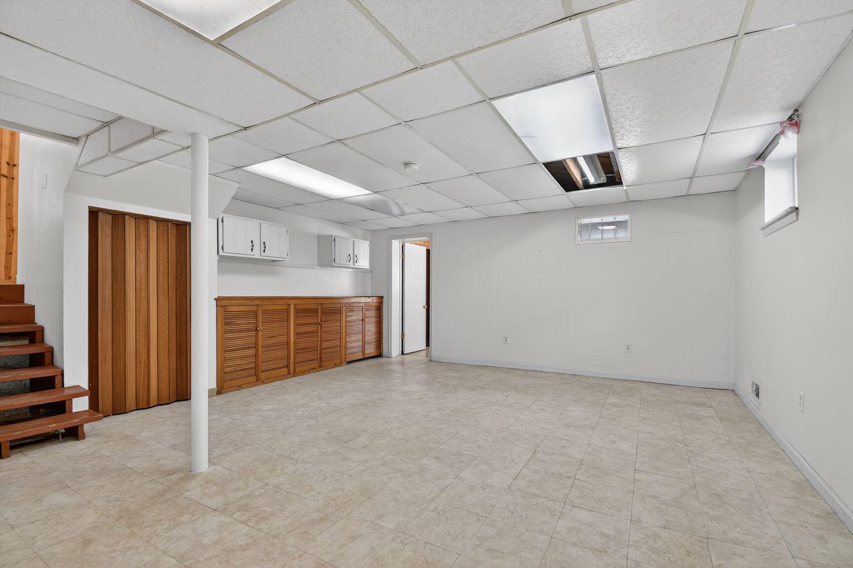 10226 Leslie Street Silver Spring, MD 20910 - Photo 23 of 32 an empty room with a empty space and windows