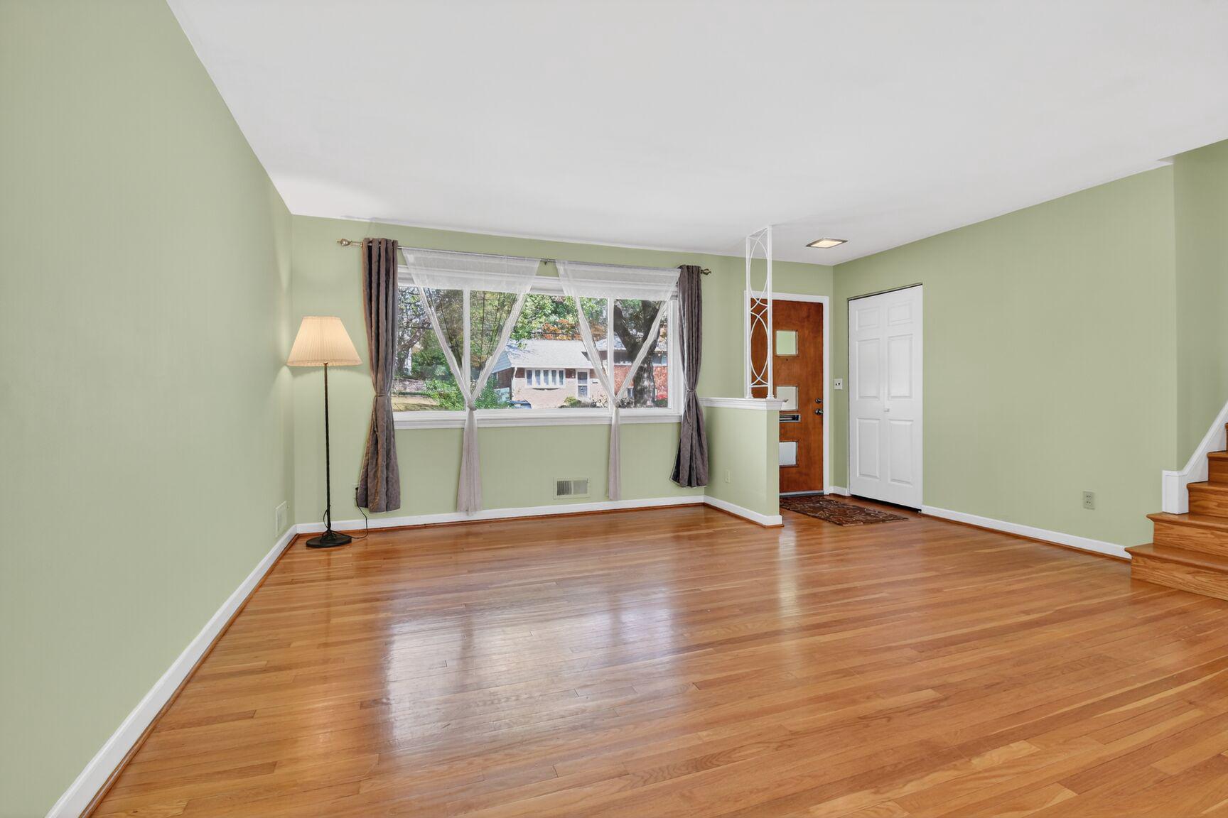 10226 Leslie Street Silver Spring, MD 20910 - Photo 3 of 32 a view of empty room with wooden floor and fan