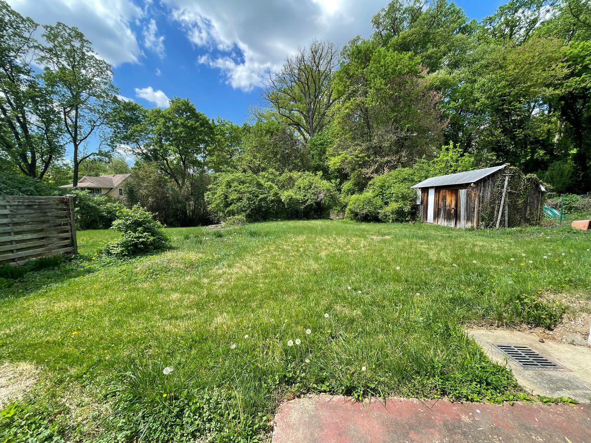 10226 Leslie Street Silver Spring, MD 20910 - Photo 31 of 32 a view of a house with a backyard
