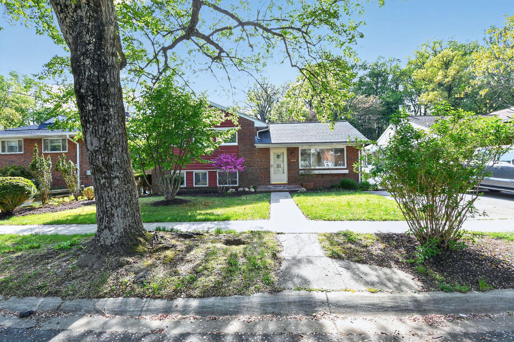 10226 Leslie Street Silver Spring, MD 20910 - Photo 32 of 32 a view of a house with a yard and large tree