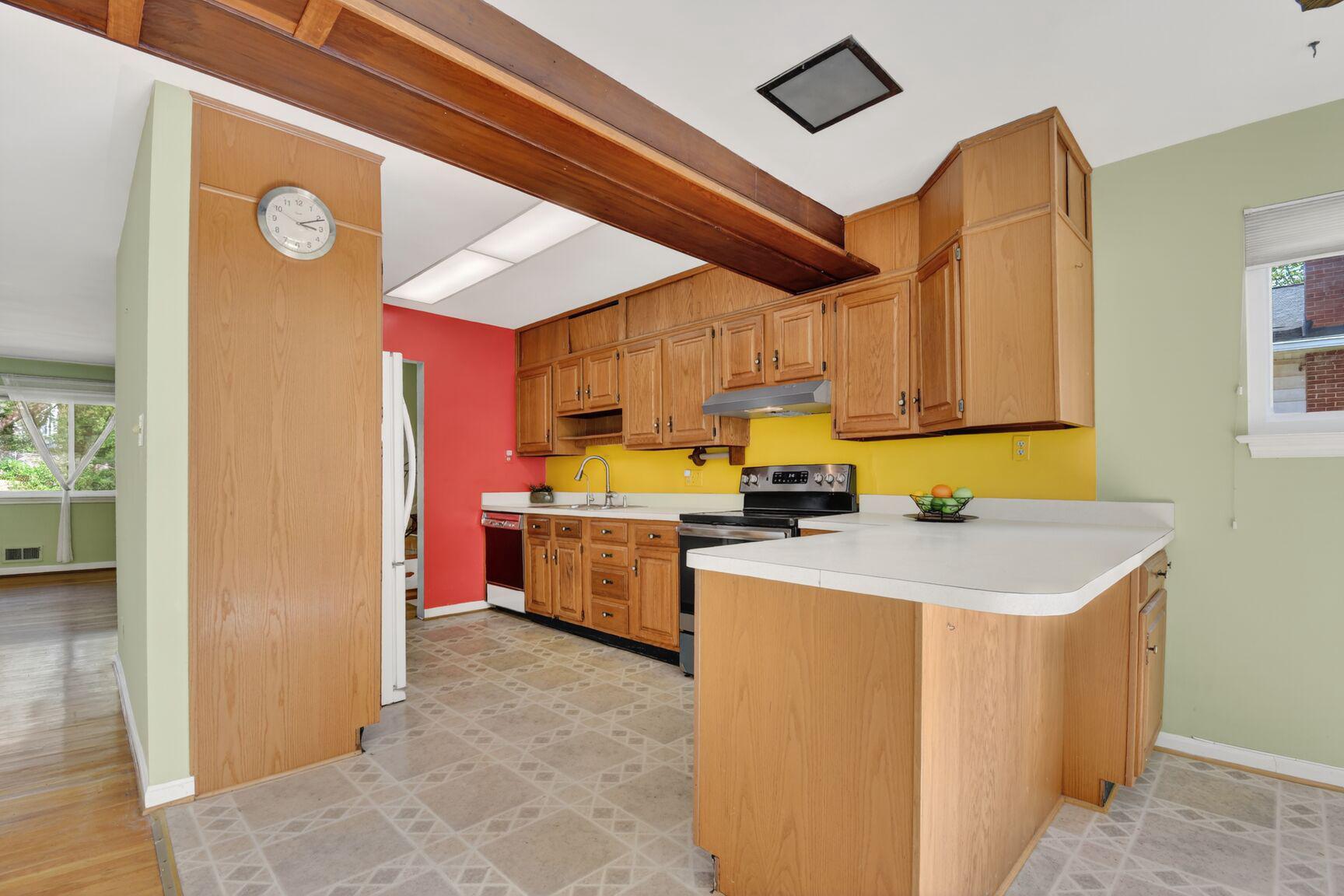 10226 Leslie Street Silver Spring, MD 20910 - Photo 9 of 32 a kitchen that has a sink and a stove top oven