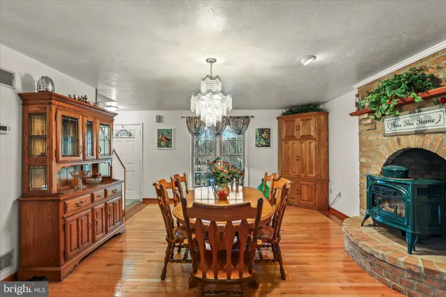 a bathroom with a sink a mirror a glass door shower and a mirror