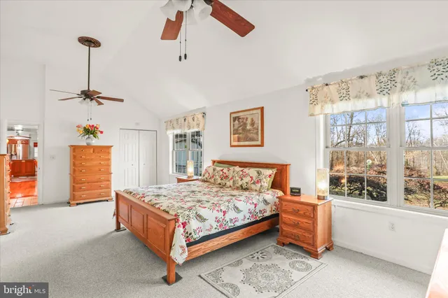 a room with a bed and a dresser