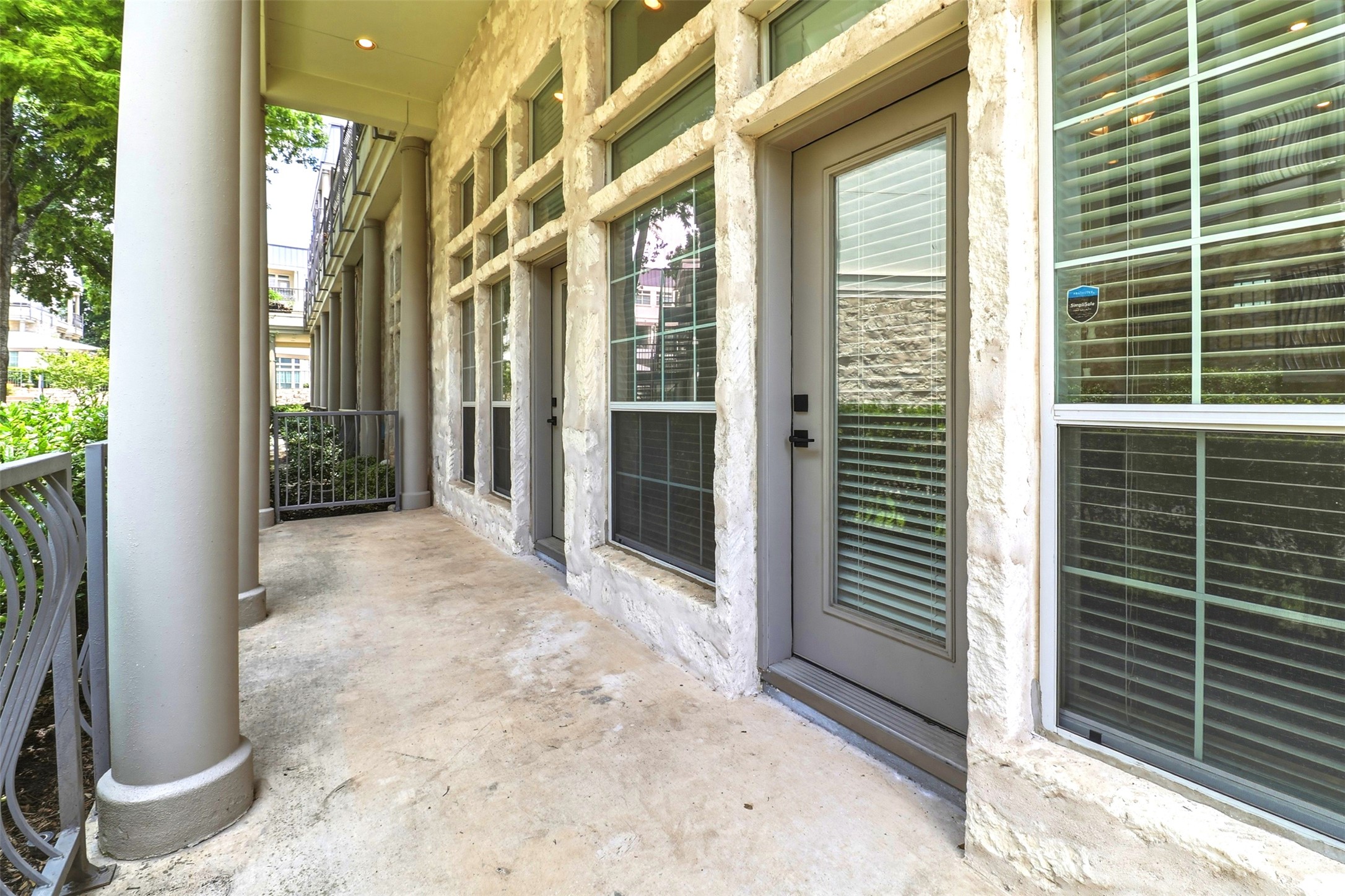 2918 Ranch Road 620, Unit 265 Austin, TX 78734 - Photo 20 of 40 A private porch space with robust columns and ample natural light from extensive window walls.