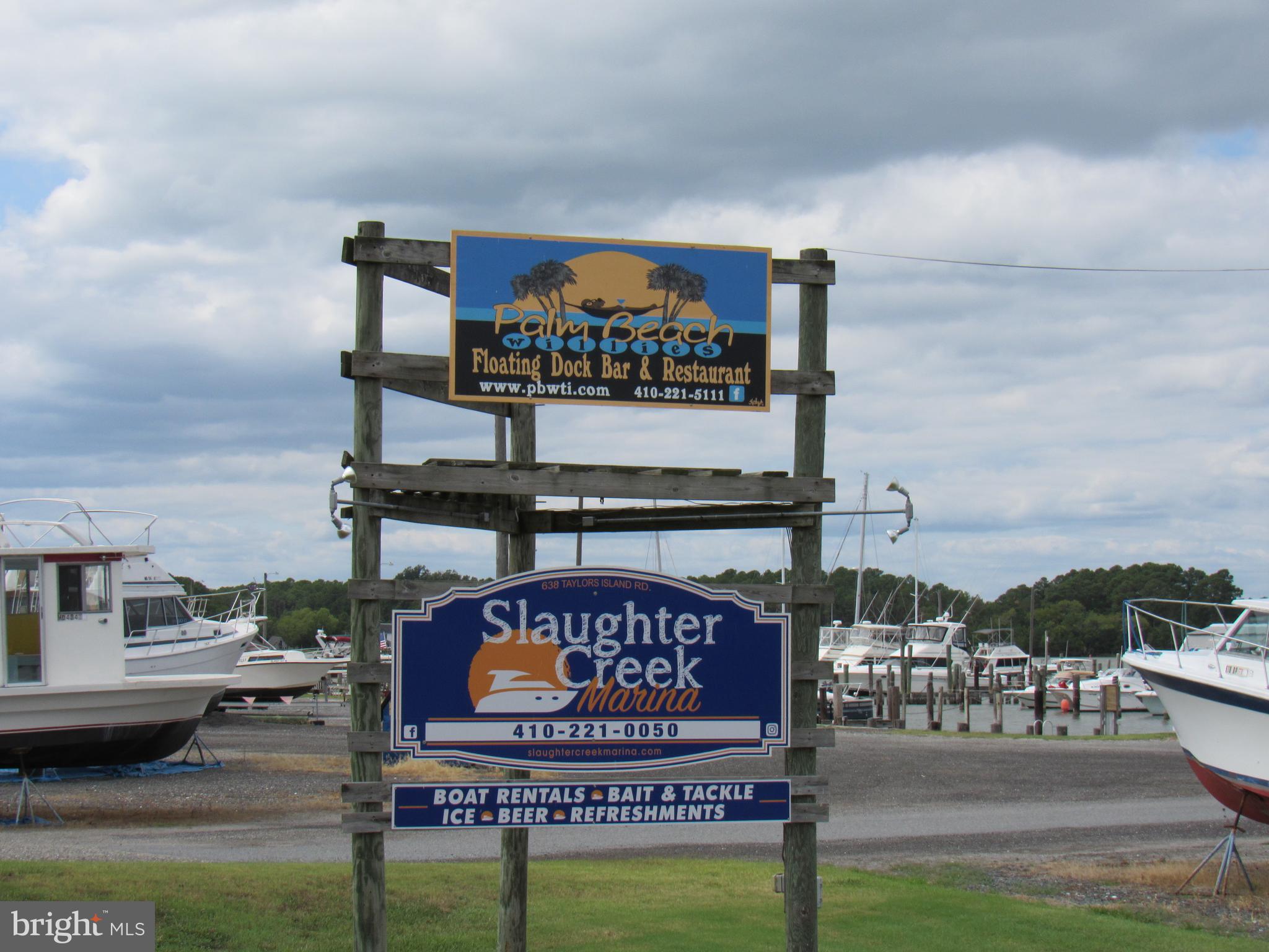 4420 Hooper Neck Road Taylors Island, MD 21669 - Photo 7 of 10 a sign on the side of the building