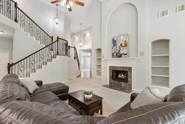 a living room with furniture and a fireplace