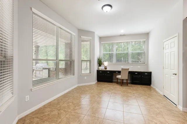 a bathroom with a double vanity sink mirror and bathtub