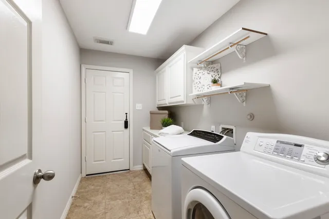 a bathroom with double sink and a mirror
