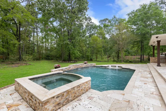 a view of house with a yard