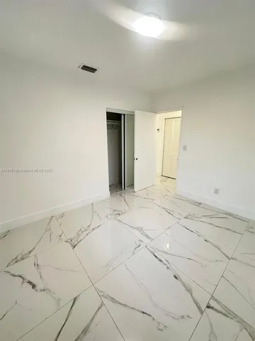 en empty room with white walls