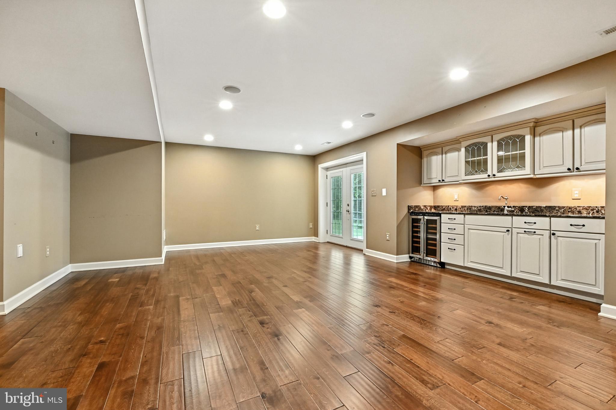 1901 Eamons Way Annapolis, MD 21401 - Photo 20 of 64 a view of a kitchen with granite countertop a stove top oven a sink and dishwasher with wooden floor