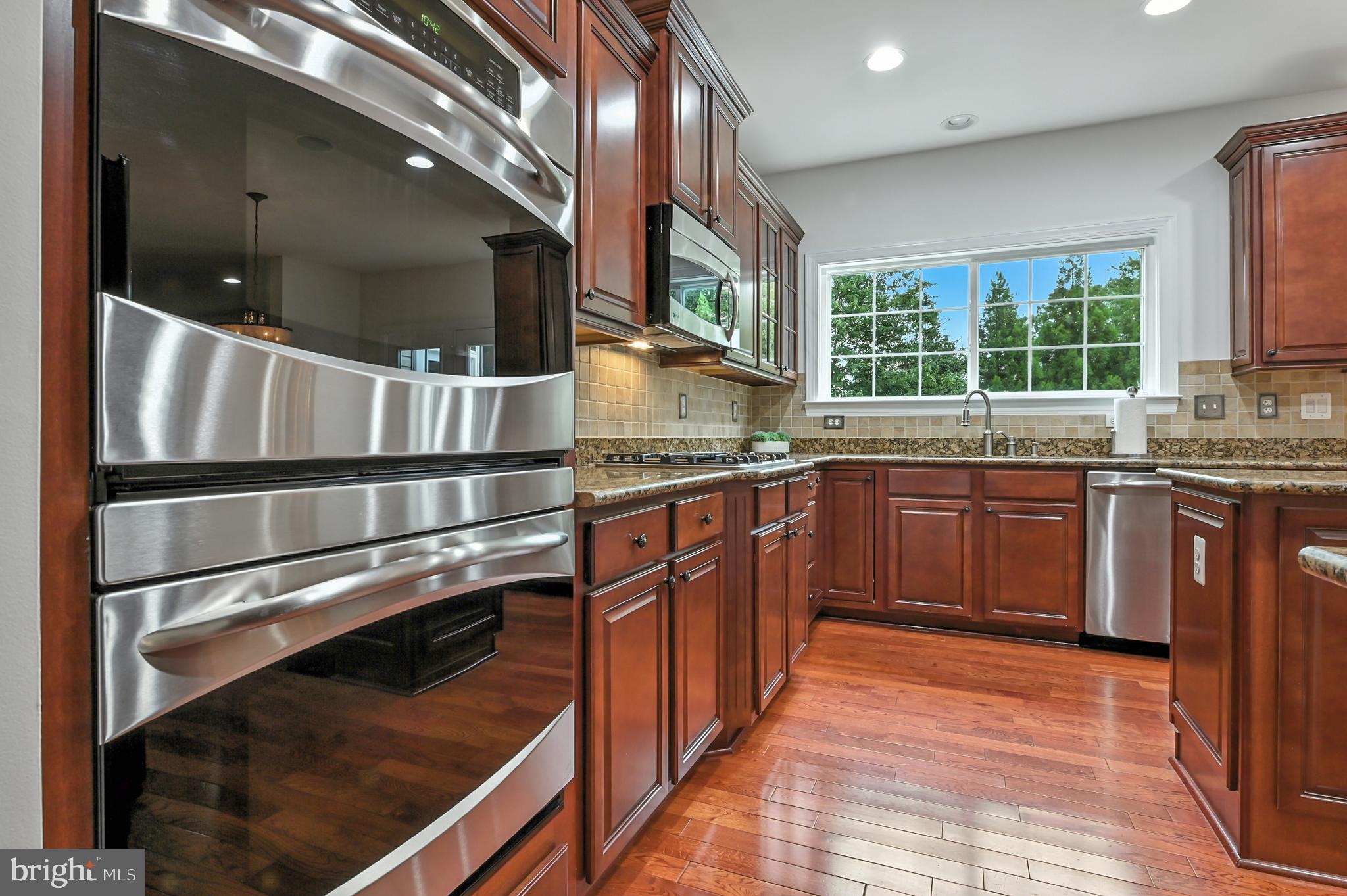 1901 Eamons Way Annapolis, MD 21401 - Photo 25 of 64 a kitchen with stainless steel appliances granite countertop a stove and a sink