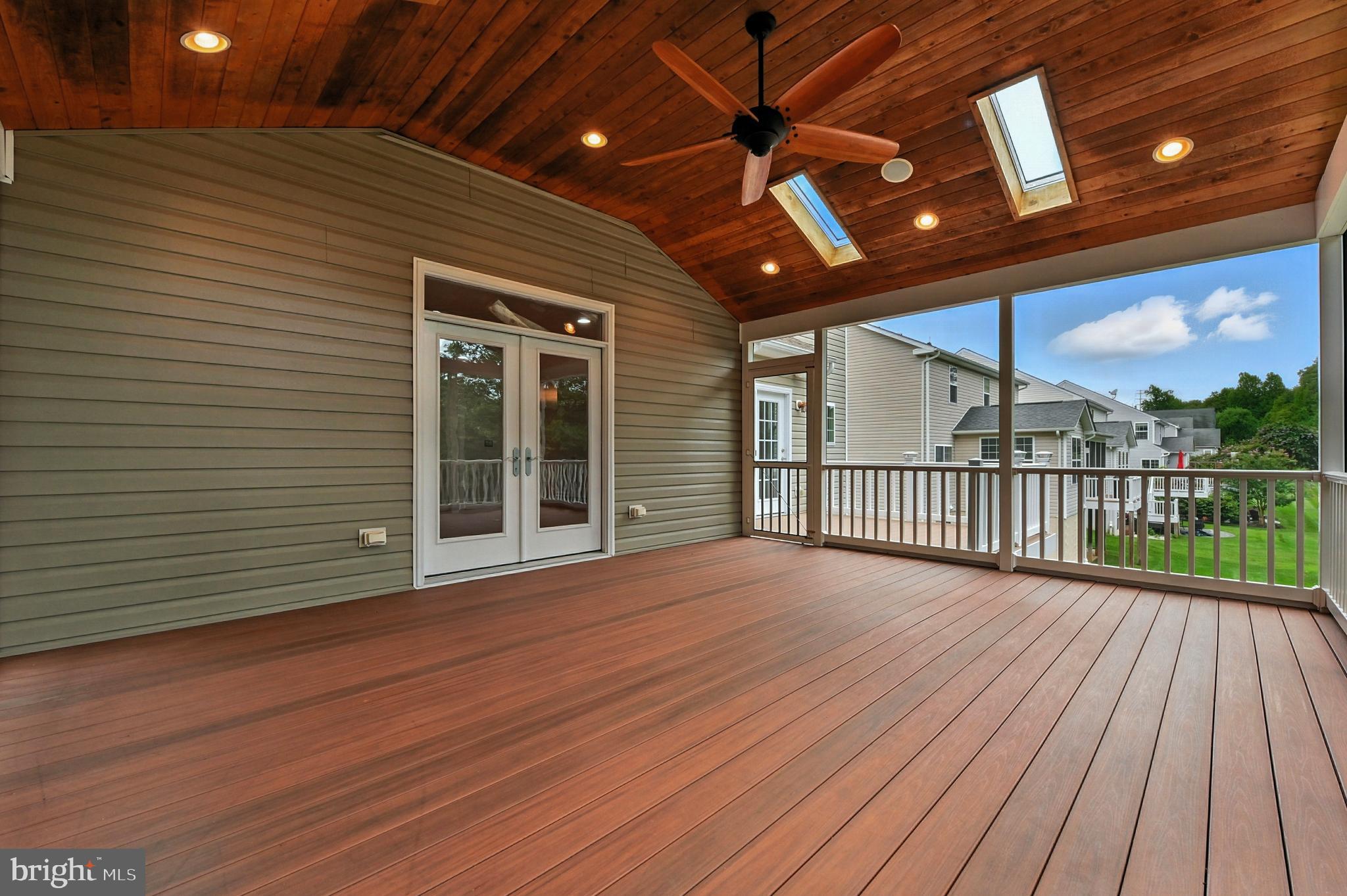 1901 Eamons Way Annapolis, MD 21401 - Photo 27 of 64 a view of a deck with wooden floor and fence with a floor to ceiling window