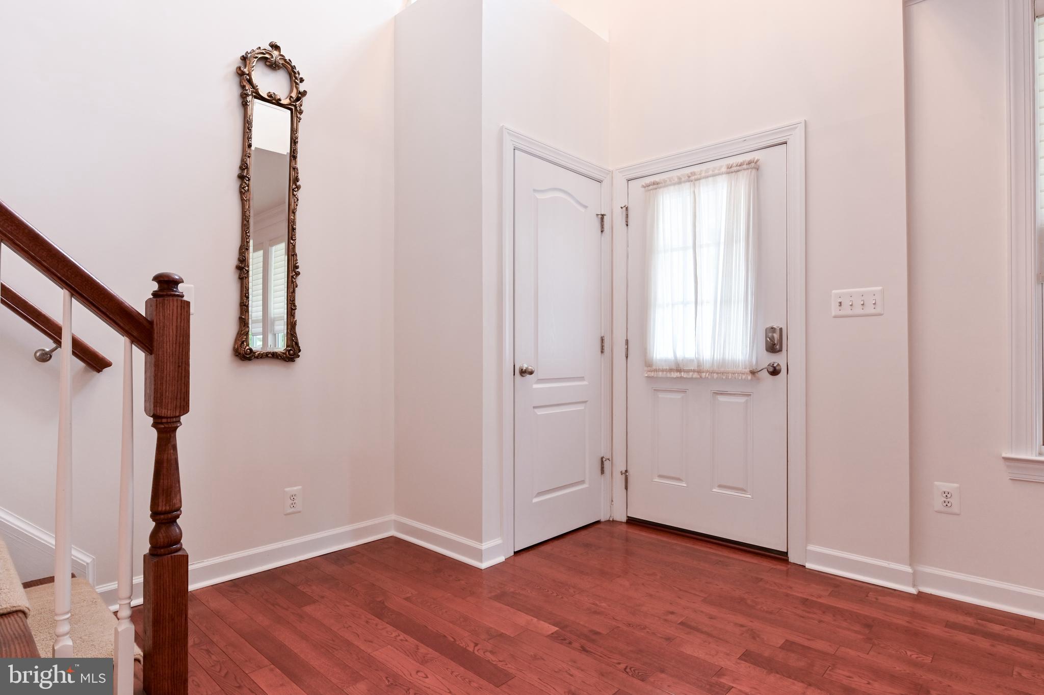 1901 Eamons Way Annapolis, MD 21401 - Photo 44 of 64 a view of hallway with stairs and wooden floor