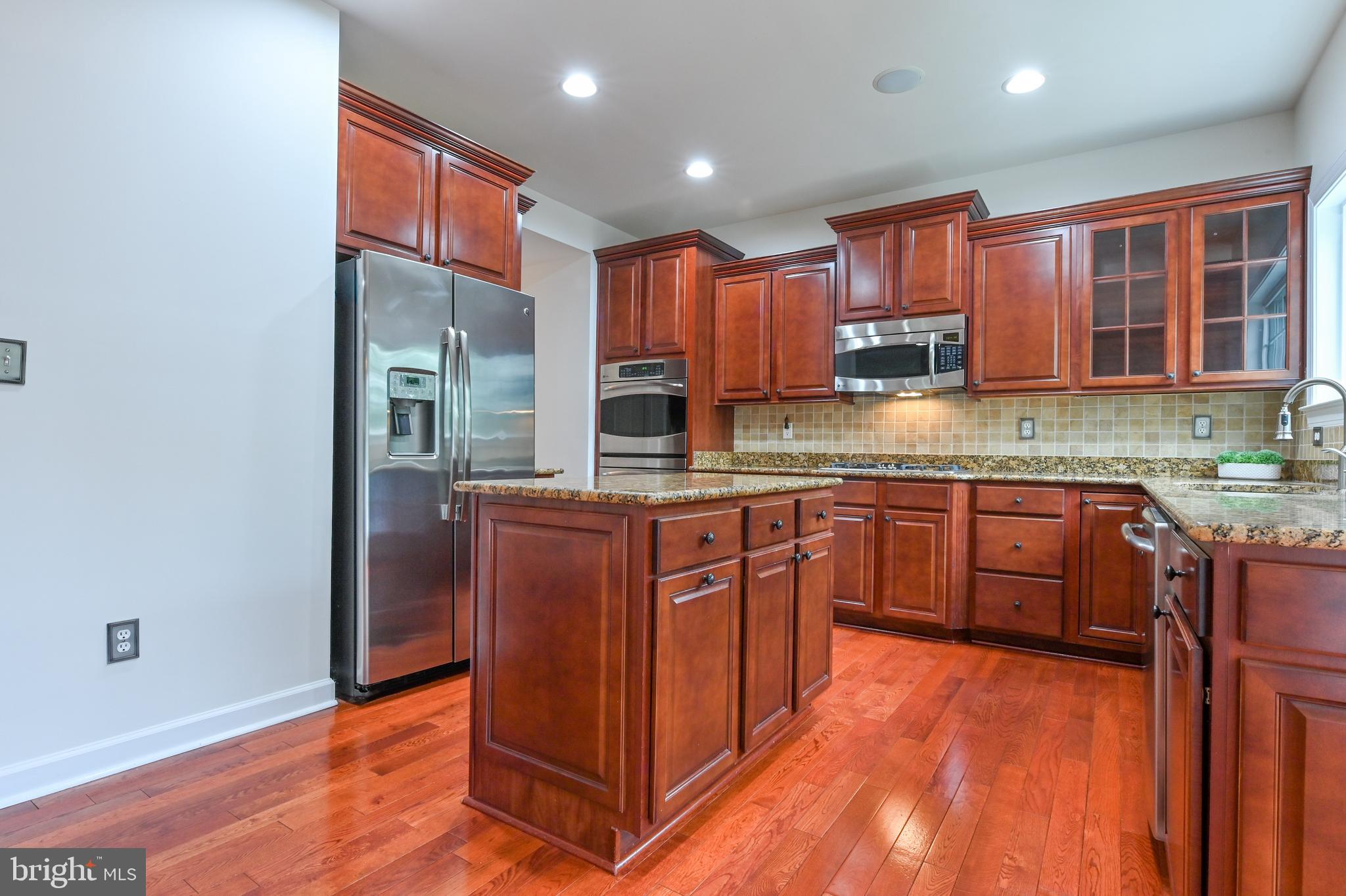 1901 Eamons Way Annapolis, MD 21401 - Photo 45 of 64 a kitchen with stainless steel appliances granite countertop a stove a sink and a refrigerator
