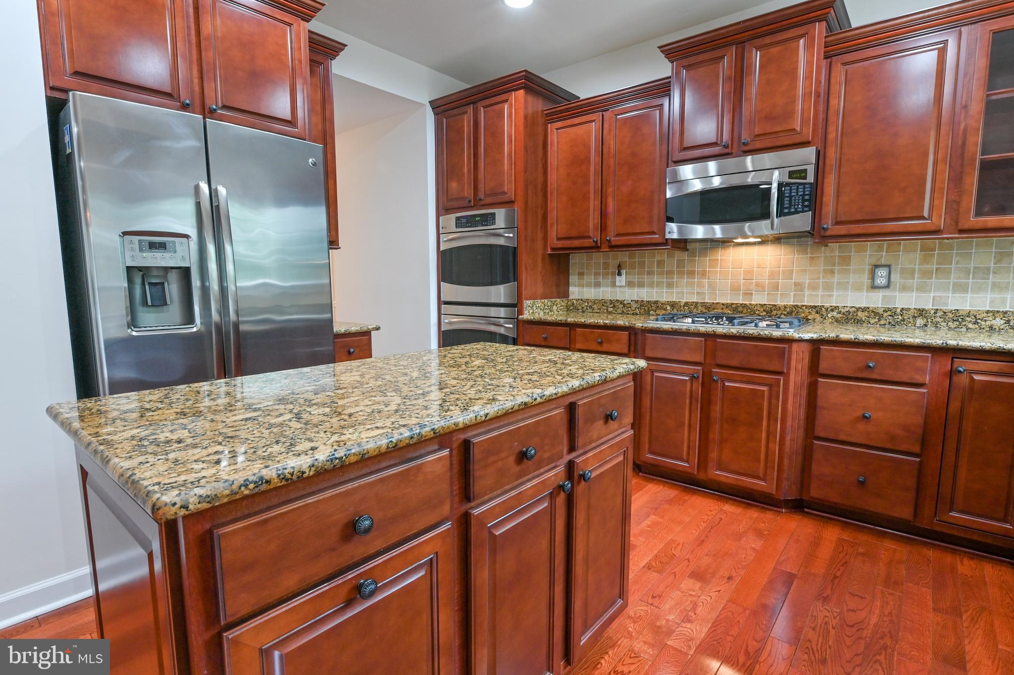 1901 Eamons Way Annapolis, MD 21401 - Photo 46 of 64 a kitchen with stainless steel appliances granite countertop wooden cabinets and a counter top space