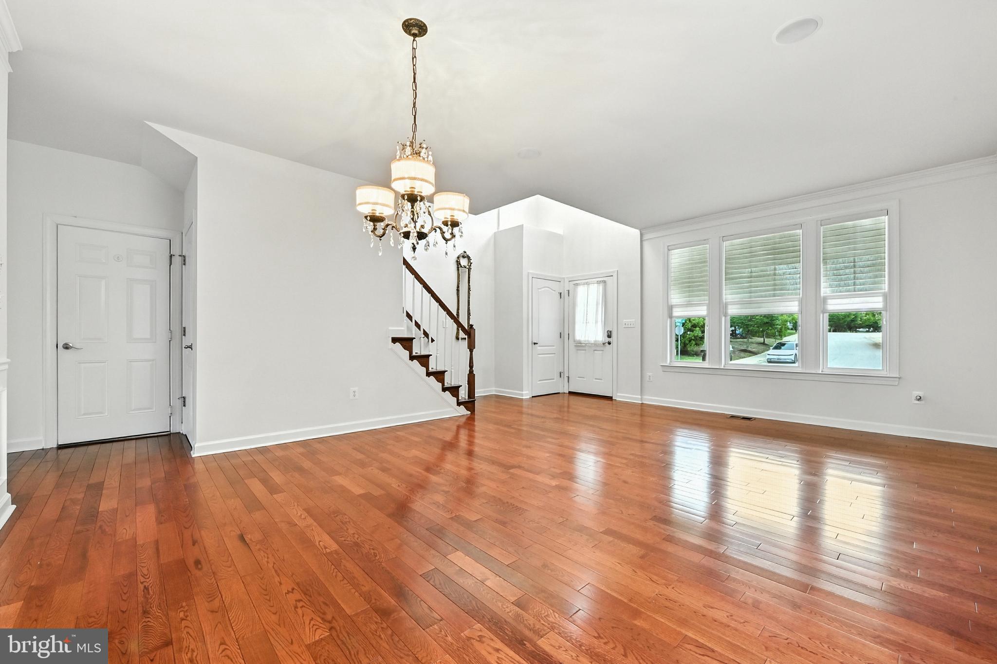 1901 Eamons Way Annapolis, MD 21401 - Photo 52 of 64 a view of an empty room with wooden floor and a window