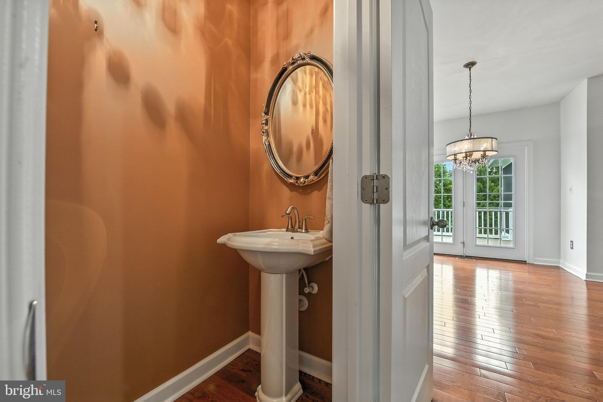 1901 Eamons Way Annapolis, MD 21401 - Photo 53 of 64 a bathroom with a sink a mirror and a window